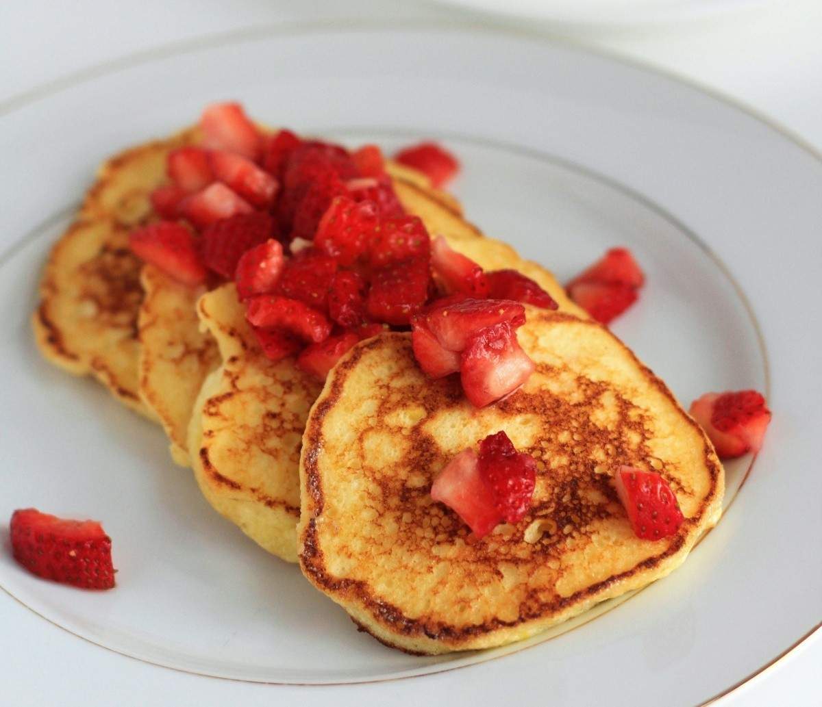 Lemon soufflé pancakes with macerated strawberries from Pucker cookbook