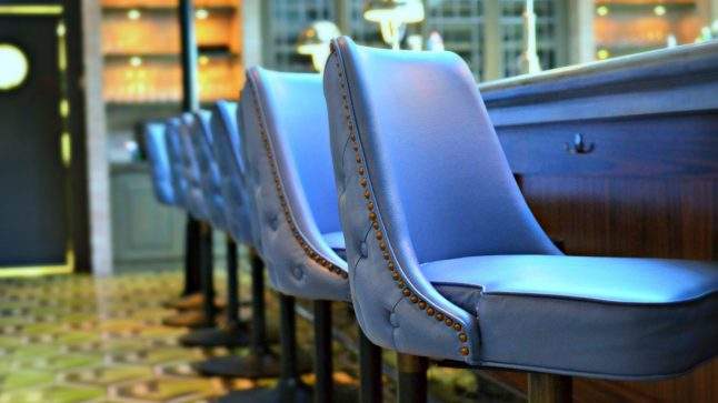 Candela's signature blue leather chairs