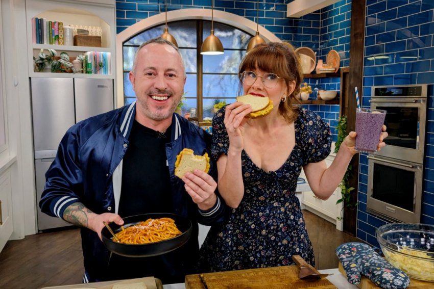 Dan Clapson and Mary Berg eating tuna melts on the set of The Good Stuff.