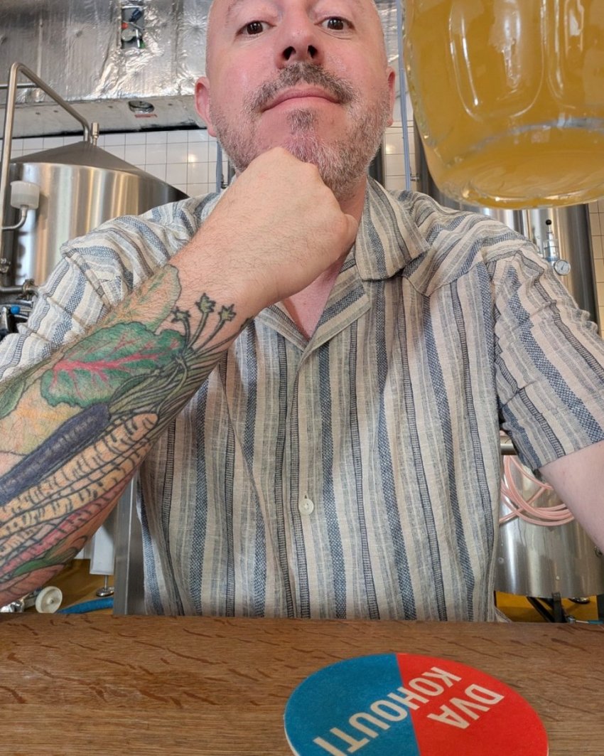 Dan Clapson drinking beer inside Dva Kohouti brewery in Prague’s Karlín neighbourhood