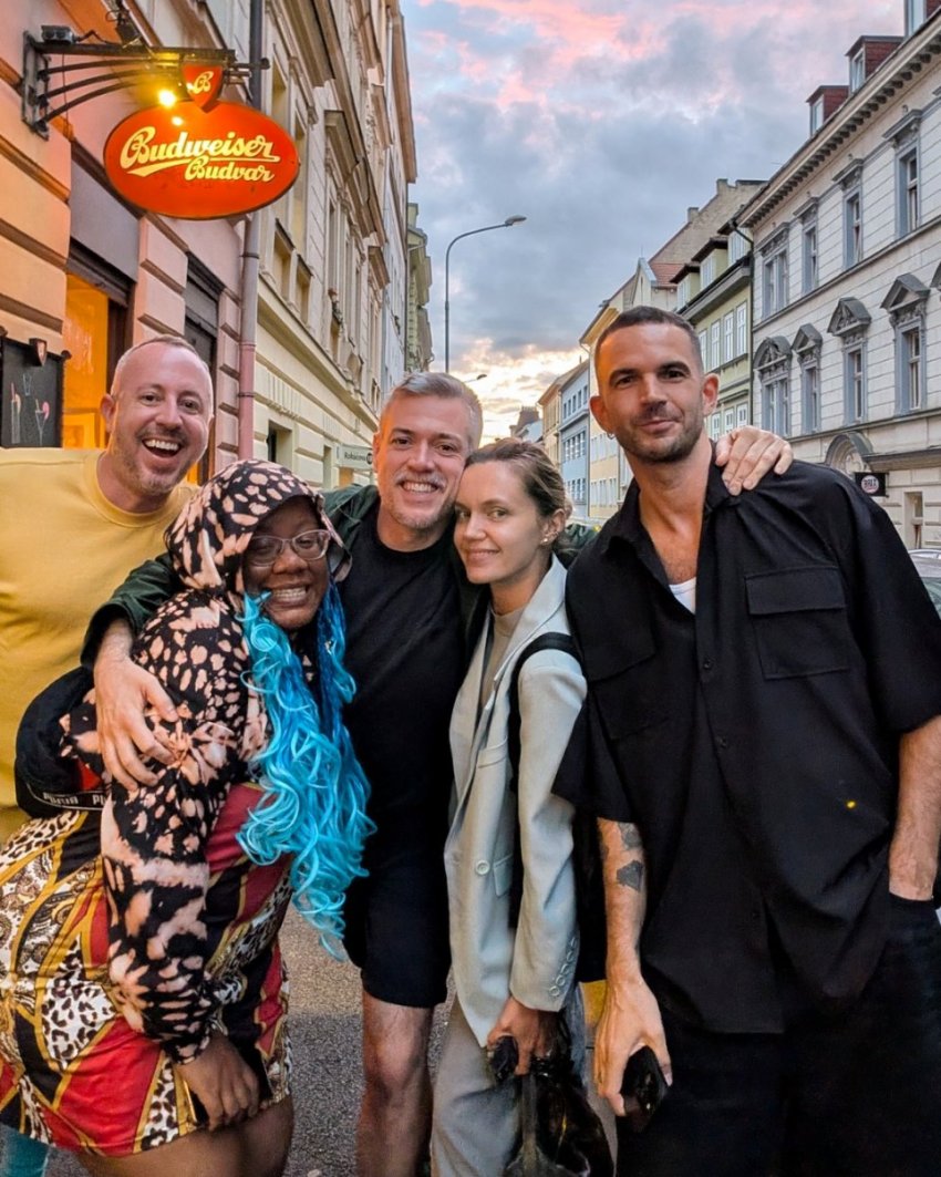 Dan Clapson and friends standing outside Mon Ami restaurant in Prague’s Žižkov neighbourhood.