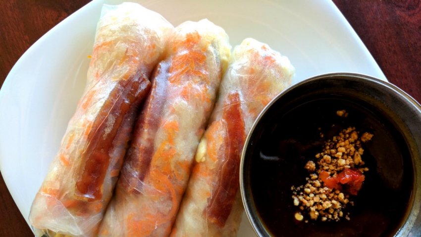 Jicama, Chinese sausage and egg salad rolls from Nho Saigon in Calgary served on a plate.