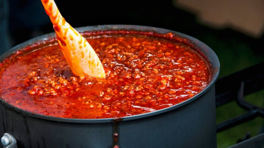 Rich and spicy meat sauce cooking for Garbage Plate-inspired tater tot cups