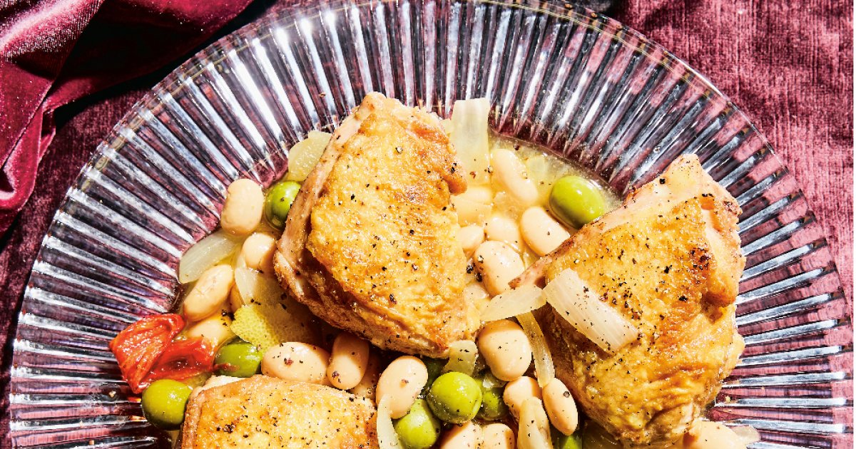 Crispy chicken thighs over vinegar beans from A Generous Meal cookbook Eat North