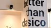 The words “better than clasico” painted on the wall inside the Prague restaurant Better Than Classico
