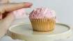 Decorating a cupcake with your hands
