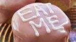 Cakes with Eat Me written in icing