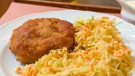A plate of mince-meat schnitzel and coleslaw at Kantýna in Prague.