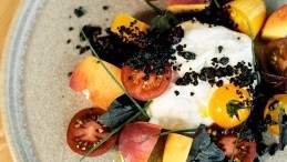 Image for 1909 Kitchen’s Heirloom peach, burrata and tomato salad