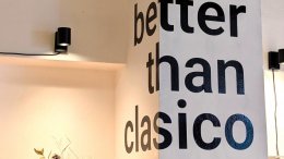 The words “better than clasico” painted on the wall inside the Prague restaurant Better Than Classico