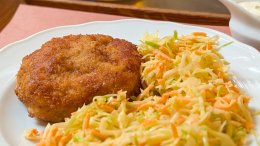 A plate of mince-meat schnitzel and coleslaw at Kantýna in Prague.