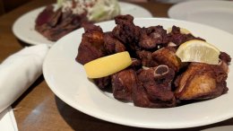 Crispy short dry ribs with lemon wedges served in the lounge at Wellington’s Steakhouse in Calgary
