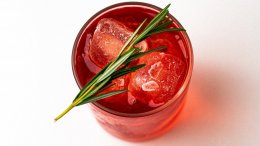 A Negroni Sbagliato with rosemary garnish for the holidays.
