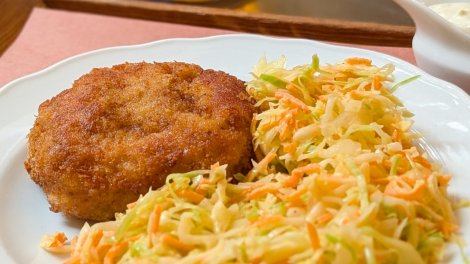 A plate of mince-meat schnitzel and coleslaw at Kantýna in Prague.