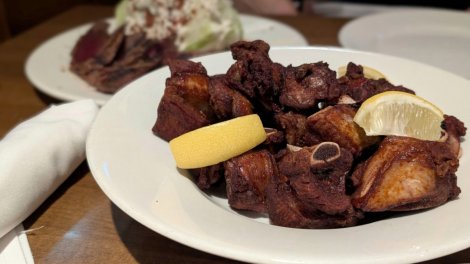 Crispy short dry ribs with lemon wedges served in the lounge at Wellington’s Steakhouse in Calgary