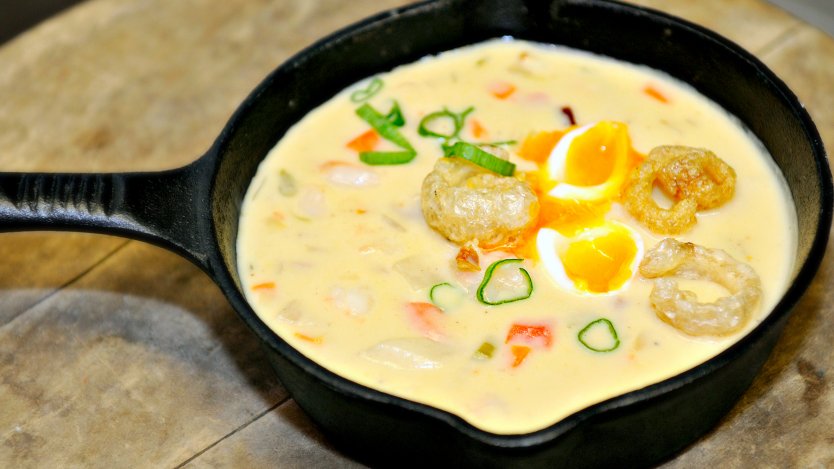 Spot prawn chowder with poached egg and chicharron