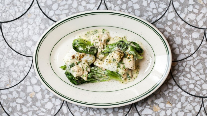 Image for Coquille's poached halibut with escarole and oyster buerre blanc