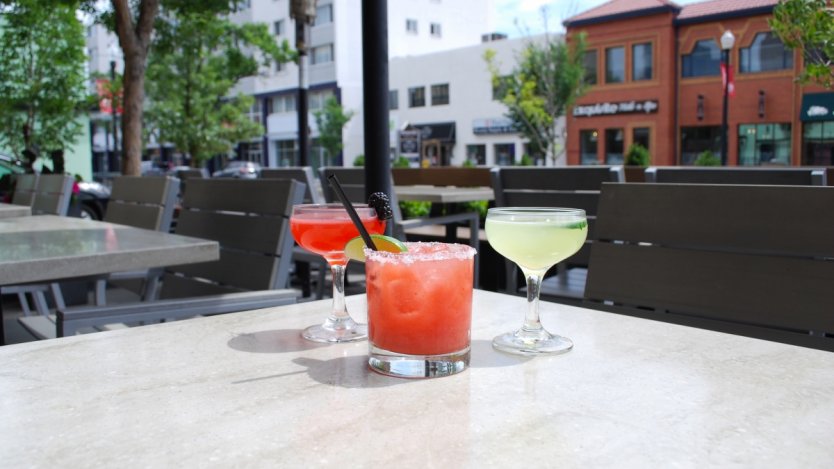 Left to right: Back to black cocktail with bourbon, Yuzuus cocktail with yuzu, and Ray Romano cocktail with lime, Thai basil and cucumber.