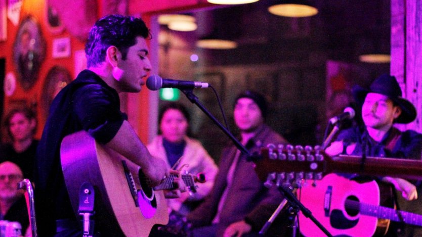 Photo of singer Awab Paracha performing during a Blue Jay Sessions event by Emily Holloway.