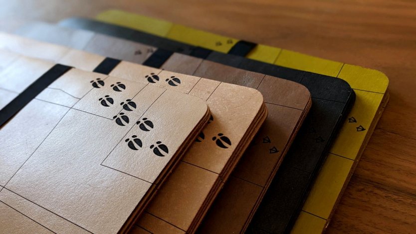 Laser cut "farmers' field" leather placemats by Calgary's LTHR BAR.