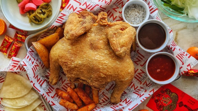 Chef Jinhee Lee's Lunar New Year chicken dinner at JINBAR. Photo by Dan Clapson.
