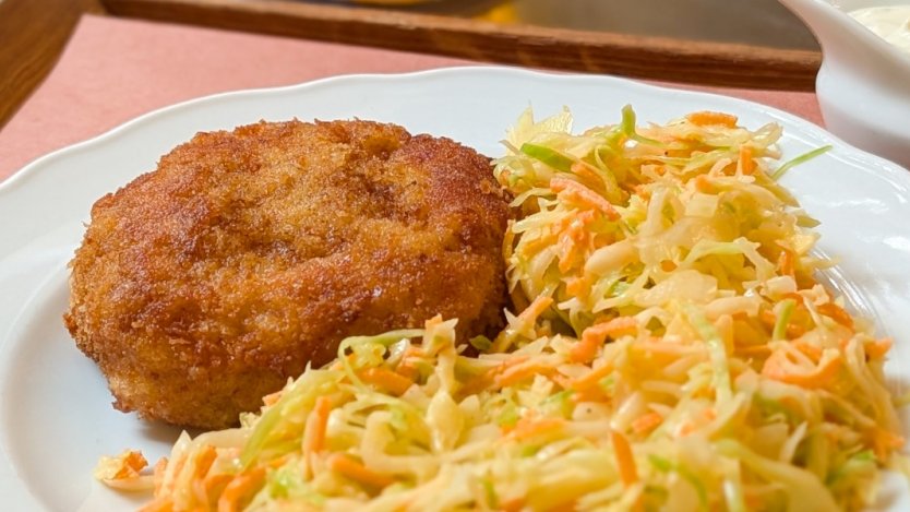 A plate of mince-meat schnitzel and coleslaw at Kantýna in Prague.