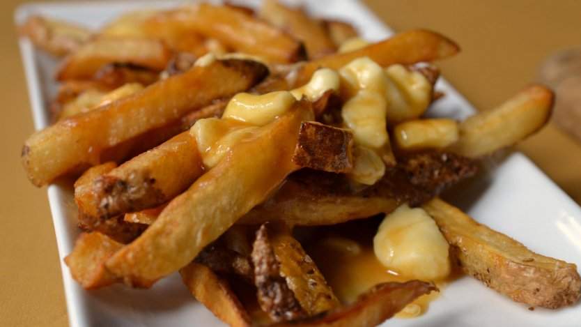 Traditional and authentic poutine. Photo by Dan Clapson. Traditional and authentic poutine.