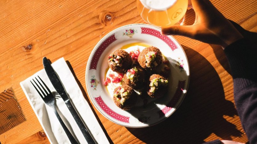 Photo of Namjim's Sai Ua Salt Cod Fritters and Bannerman Brewing beer via Facebook.