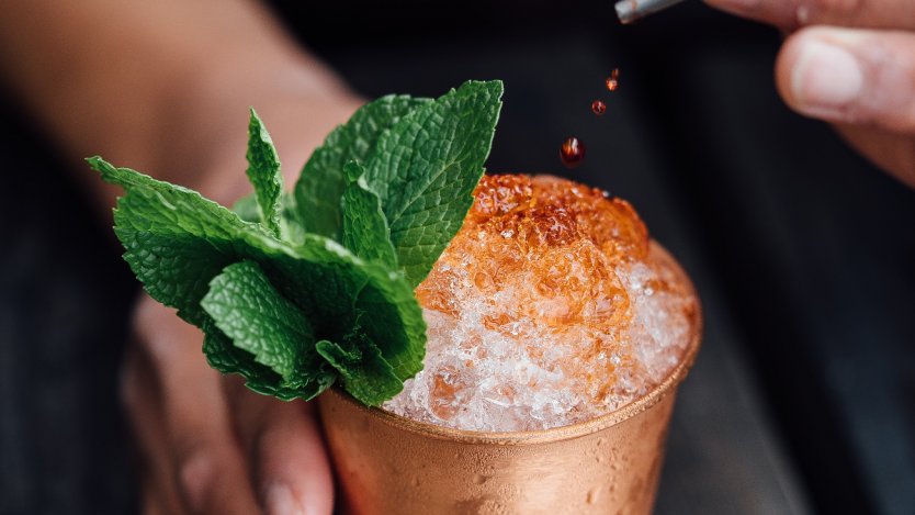 Photo of tiki cocktail via Unsplash. Tipsy Parrot Rum Shack pop-up to open in the Fairmont Palliser
