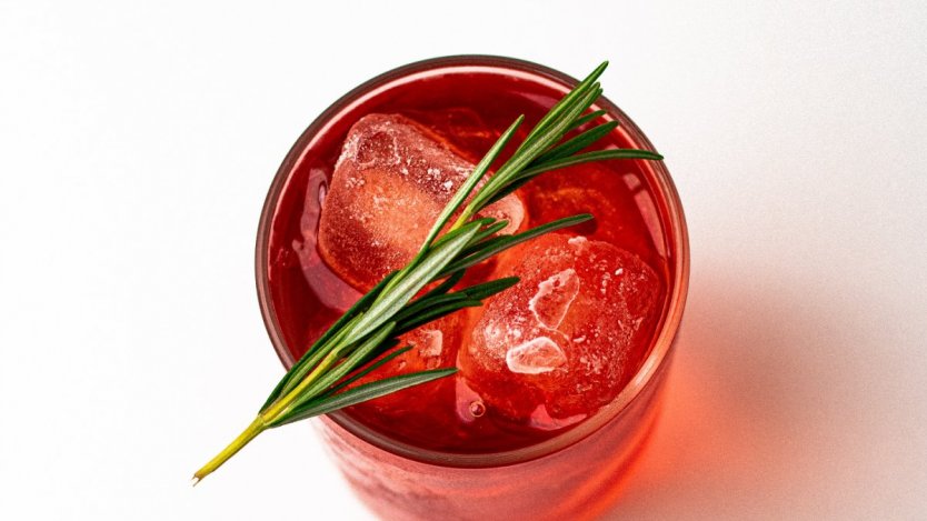 A Negroni Sbagliato with rosemary garnish for the holidays.