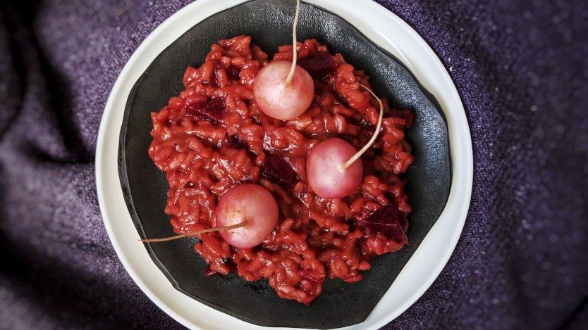 Beets and radishes help bring this spooky risotto to life...or should we say "death"? Image for A delicious Halloween risotto recipe to try