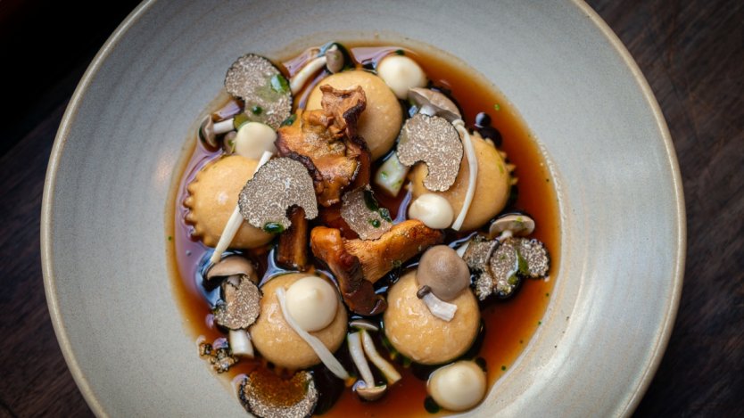 Image for Wildebeest's ravioli mushroom with consommé, garlic  purée and pickled  mushrooms